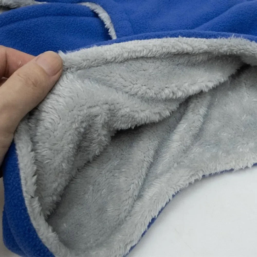 Hand showing the thick plush velvet lining inside the balaclava