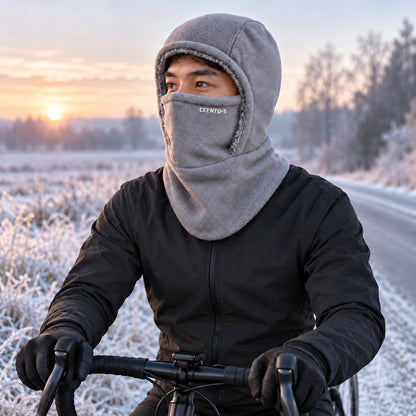 Cyclist wearing the grey fleece balaclava on a frosty morning road