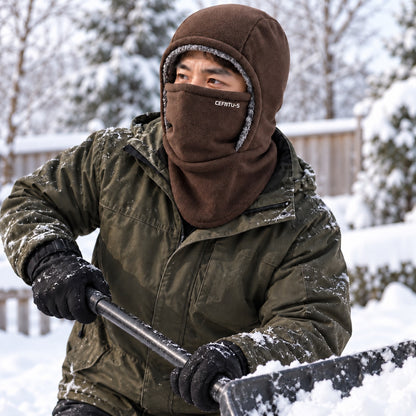 Person wearing the brown fleece balaclava while shovelling snow